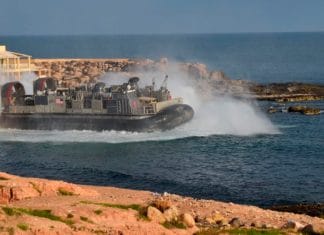 U.S. amphibious hovercraft departs with evacuees from Janzur, west of Tripoli, Libya