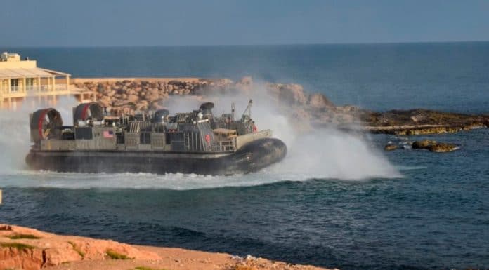 U.S. amphibious hovercraft departs with evacuees from Janzur, west of Tripoli, Libya