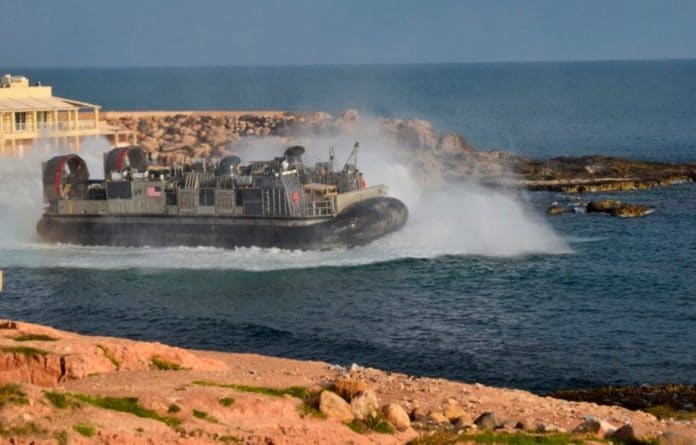 U.S. amphibious hovercraft departs with evacuees from Janzur, west of Tripoli, Libya
