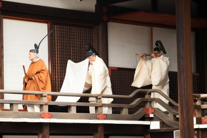 Japan's Emperor Akihito leaves after a ritual to report his abdication to the throne