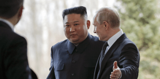 Russian President Vladimir Putin, right, welcomes North Korea's leader Kim Jong Un