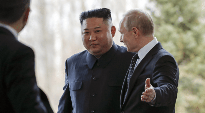 Russian President Vladimir Putin, right, welcomes North Korea's leader Kim Jong Un