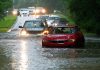 Vehicles wade through flooded Kingwood Drive as deadly thunderstorms hit the Kingwood area Tuesday, May 7, 2019, in Texas.