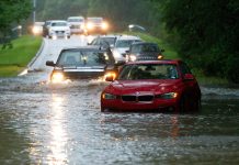Vehicles wade through flooded Kingwood Drive as deadly thunderstorms hit the Kingwood area Tuesday, May 7, 2019, in Texas.