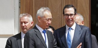 Chinese Vice Premier Liu He (2nd L) says goodbye to U.S. Treasury Secretary Steven Mnuchin as they break from meetings at the USTR offices May 10, 2019