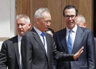 Chinese Vice Premier Liu He (2nd L) says goodbye to U.S. Treasury Secretary Steven Mnuchin as they break from meetings at the USTR offices May 10, 2019