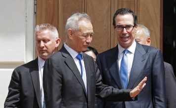 Chinese Vice Premier Liu He (2nd L) says goodbye to U.S. Treasury Secretary Steven Mnuchin as they break from meetings at the USTR offices May 10, 2019