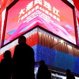 People stroll through a shopping district in the southern city of Shenzhen. Tax cuts will be one of the methods used to support the Chinese economy.