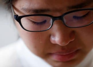 Miwa Moriya cries while she speaks during an interview with Reuters at her house in Yokohama, Japan, April 24, 2019.