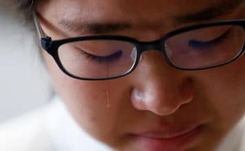 Miwa Moriya cries while she speaks during an interview with Reuters at her house in Yokohama, Japan, April 24, 2019.