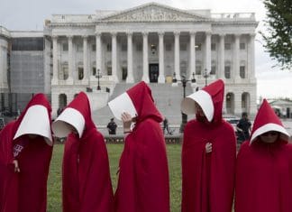 Supporters of Planned Parenthood dressed as characters from "The Handmaid's Tale,"