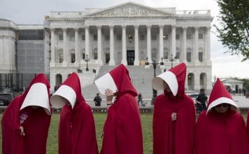 Supporters of Planned Parenthood dressed as characters from "The Handmaid's Tale,"