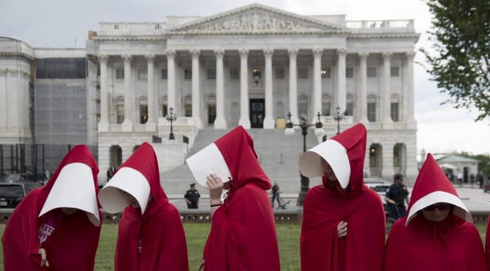 Supporters of Planned Parenthood dressed as characters from "The Handmaid's Tale,"