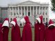 Supporters of Planned Parenthood dressed as characters from "The Handmaid's Tale,"