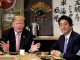 US President Donald Trump with Japanese Prime Minister Shinzo Abe during a dinner at a hibachi