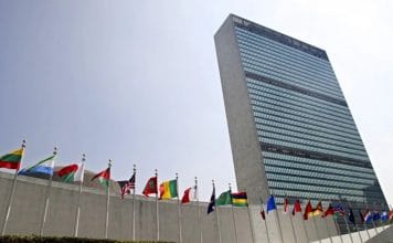 The flags of member nations fly outside the General Assembly building at the United Nations headquarters in New York.