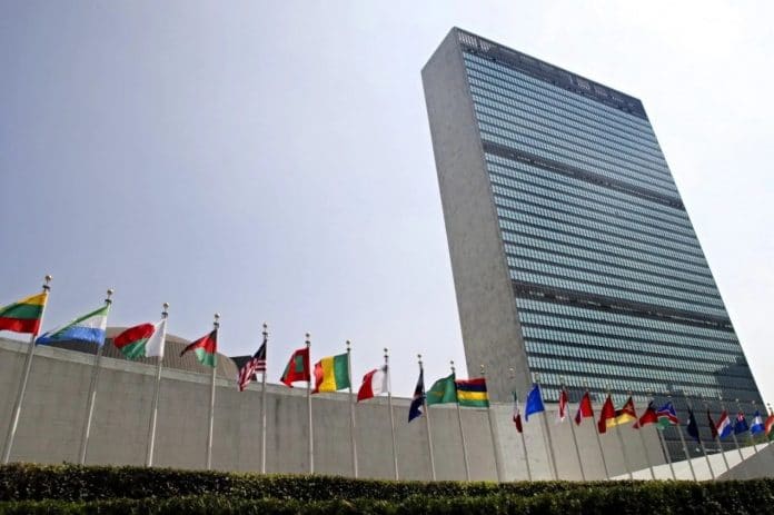 The flags of member nations fly outside the General Assembly building at the United Nations headquarters in New York.