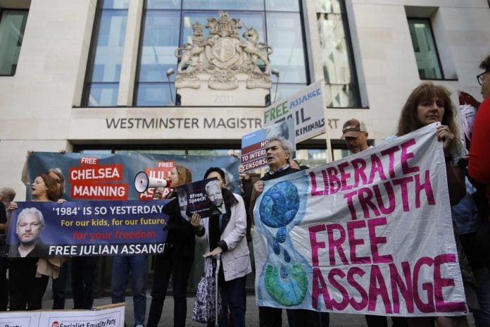 Supporters of WikiLeaks founder Julian Assange protest outside Westminster Magistrates' Court on Thursday