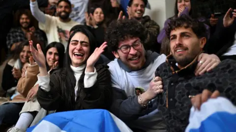 Reuters Image shows family members and supporters of Omer Wenkert reacting to his release on 22 February, 2025. Mr Wenkert had been held in Gaza as a hostage since October 7, 2023