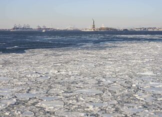 Bitter cold grips eastern US as ice forms on rivers
