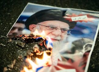 At least 3,428 killed in Iranian security crackdown on protesters, rights group says