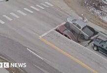Watch: Moment a sinkhole in Omaha traps cars and drivers