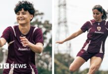 Why did only two Iranian football players stay in Australia?