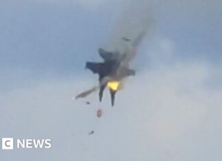 Moment two fighter jets collide mid-air at US air show