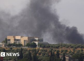 Israel carries out air strikes on Lebanon, state media says, as Iran claims deal with US near